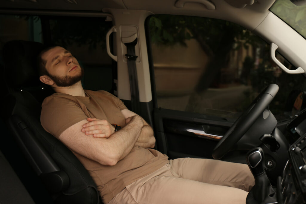 Rideshare driver Sleeping in a car